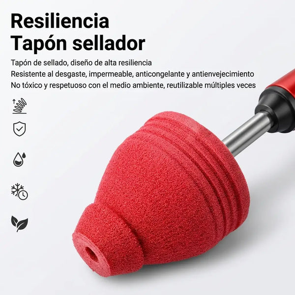 El destapador rojo con mango en T y su tapón sellador sobre el piso del baño